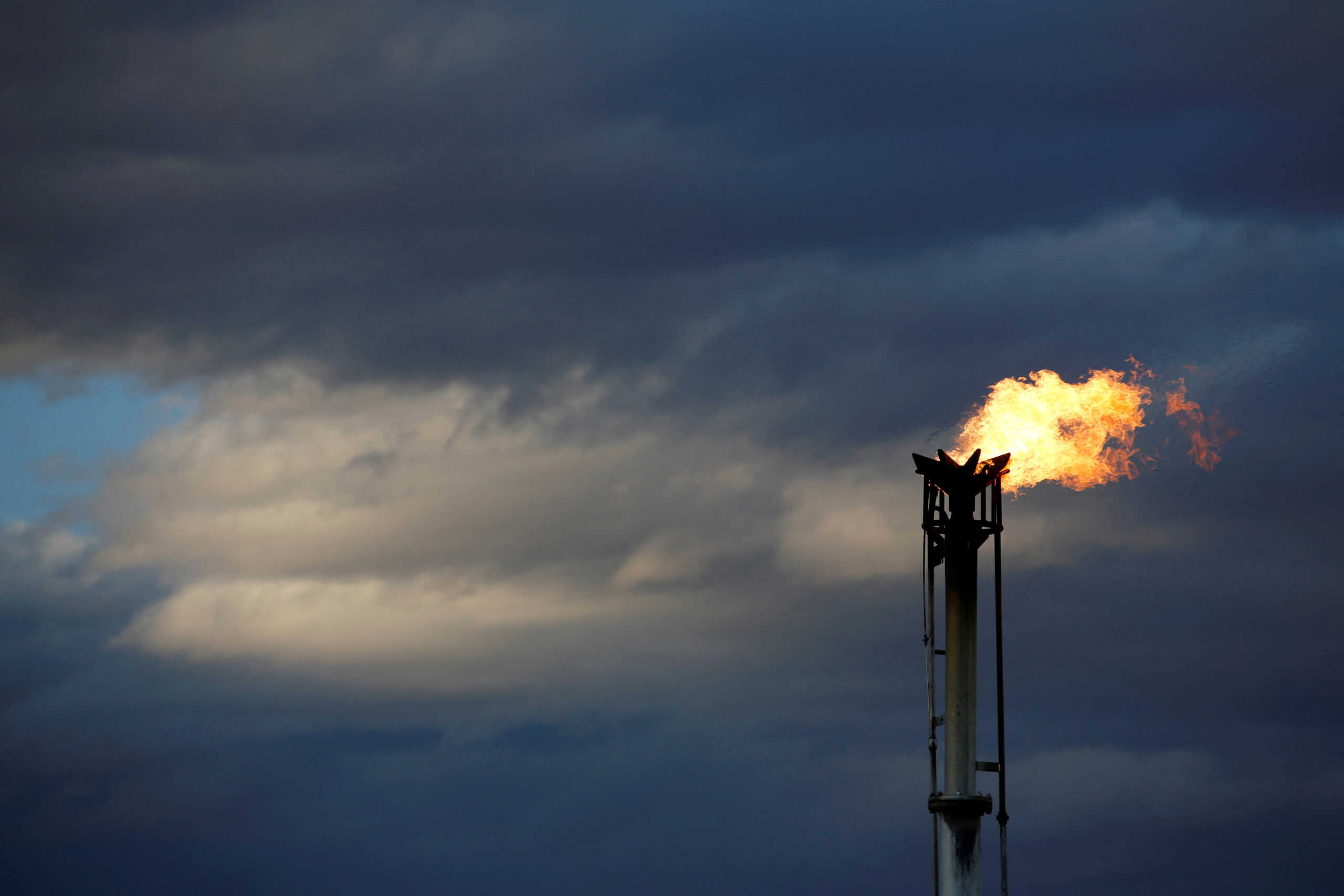 FILE PHOTO: A flare burns off excess gas from a gas plant in the Permian Basin in Loving County, Texas, U.S., November 21, 2019. REUTERS