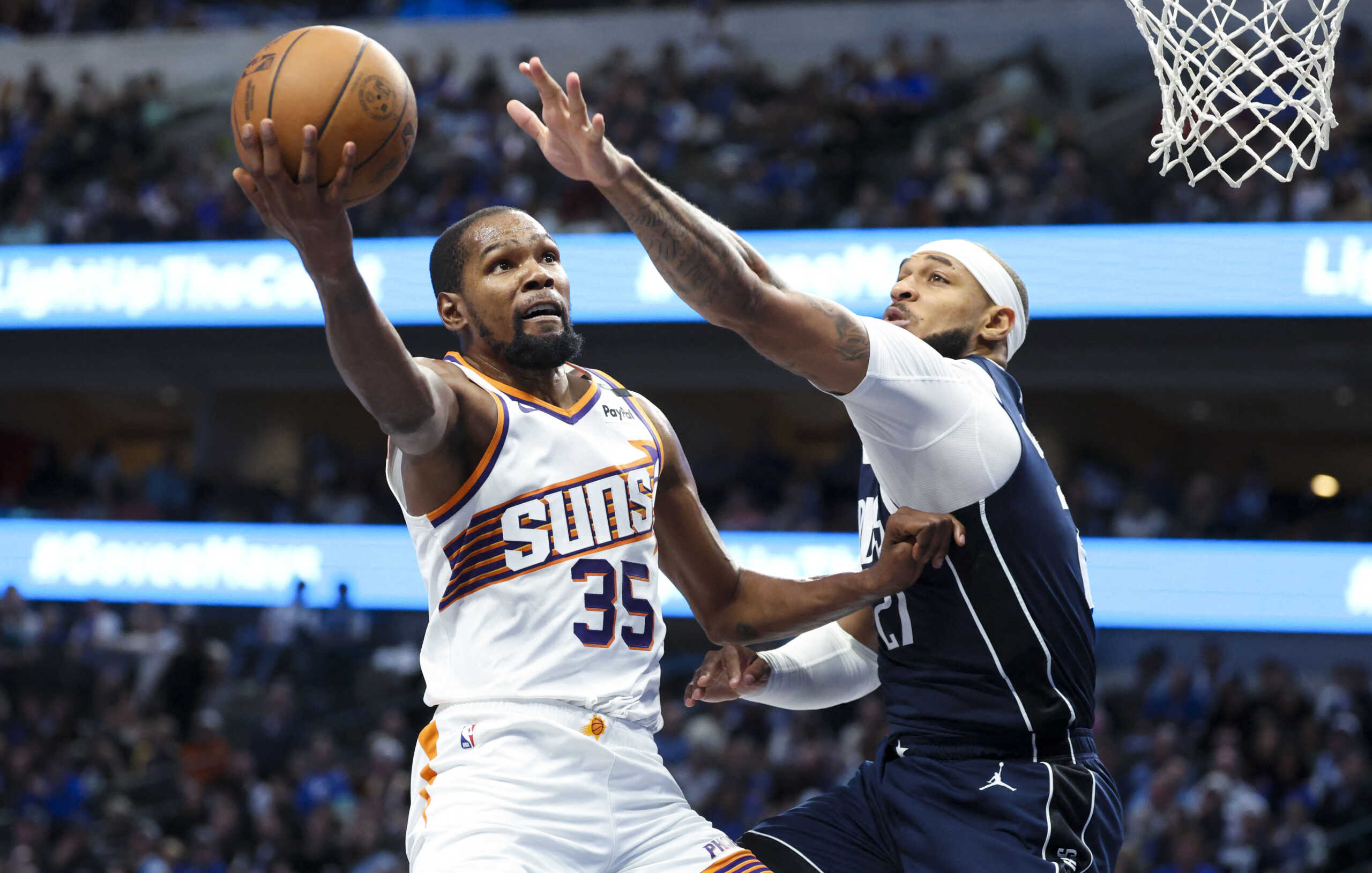 Nov 8, 2024; Dallas, Texas, USA; Phoenix Suns forward Kevin Durant (35) shoots past Dallas Mavericks center Daniel Gafford (21) during the third quarter at American Airlines Center. Mandatory Credit: Kevin Jairaj-Imagn Images