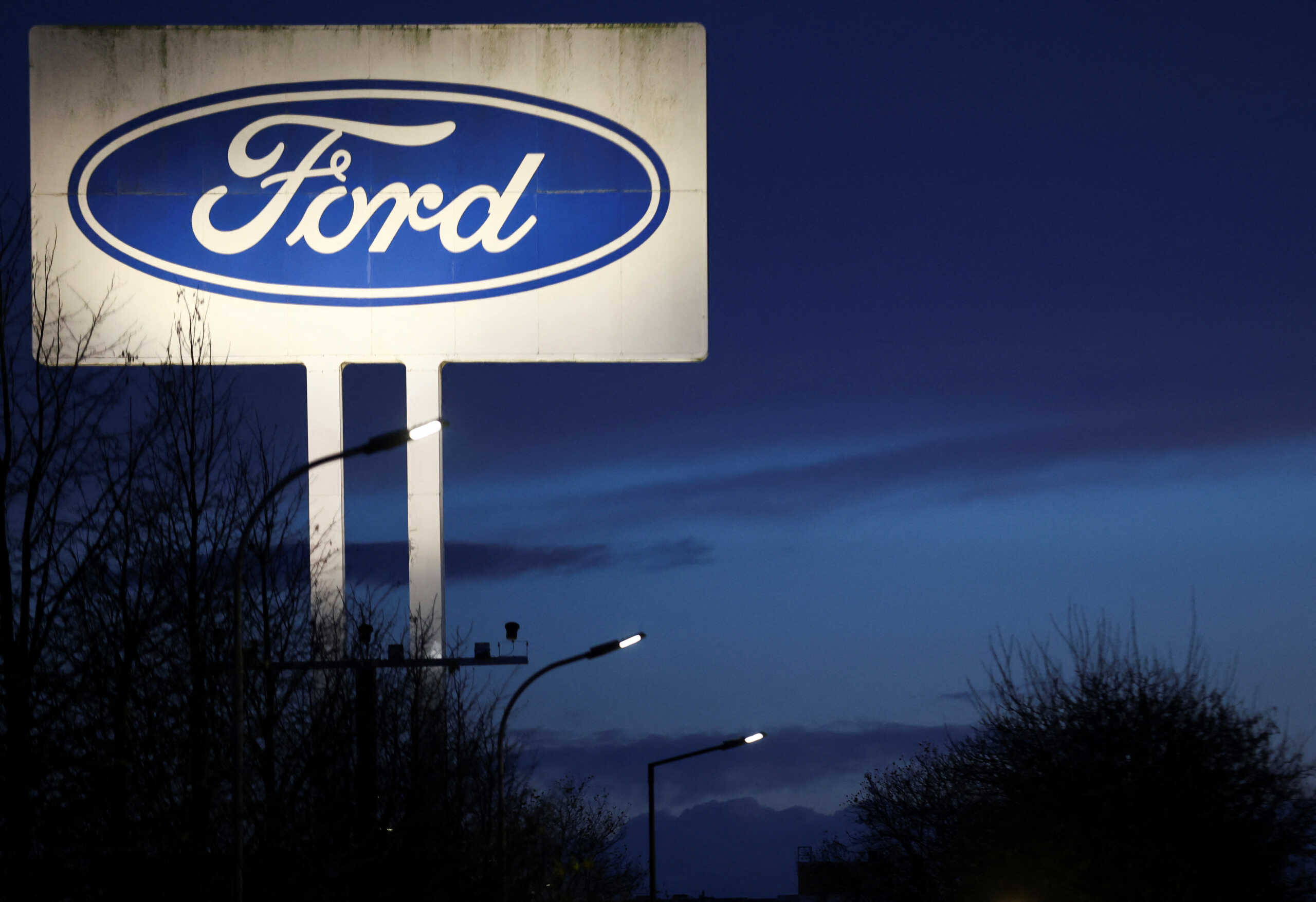 A Ford logo is seen at the Ford plant in Cologne, Germany, November 20, 2024. REUTERS