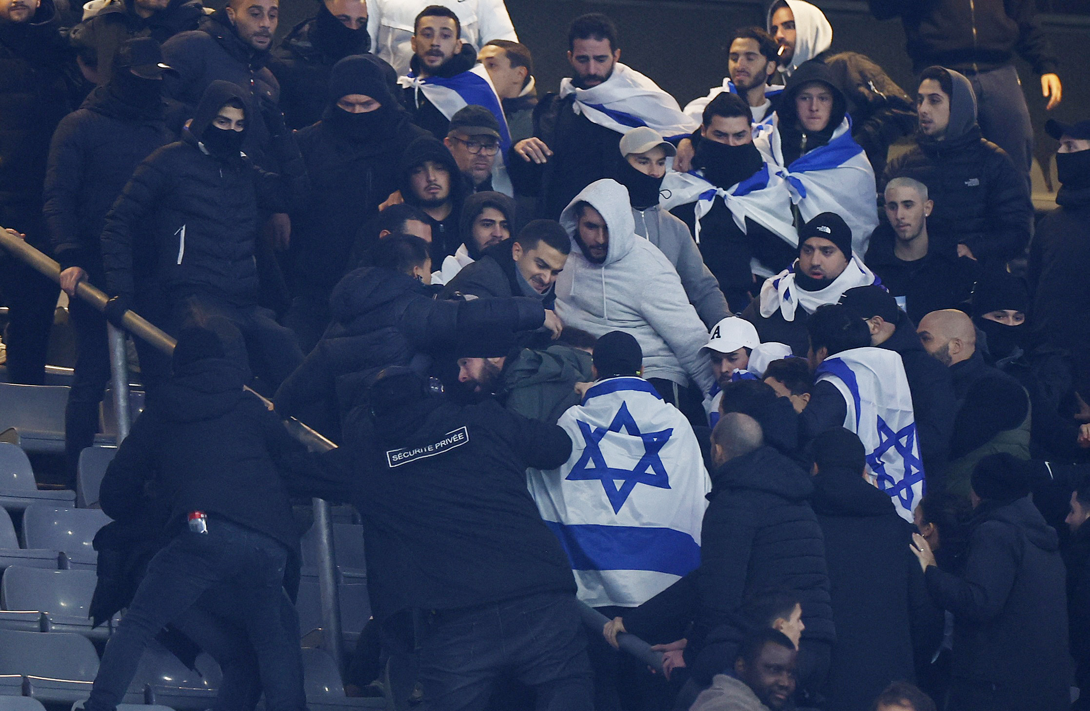 Soccer Football - Nations League - Group Stage - France v Israel - Stade de France, Saint-Denis, France  - November 14, 2024 Israel fans clash with security staff during the match REUTERS