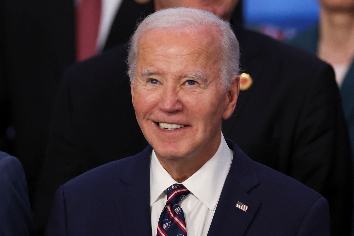 U.S. President Joe Biden prepares for a group picture at the G20 summit in Rio de Janeiro, Brazil, November 19, 2024. REUTERS