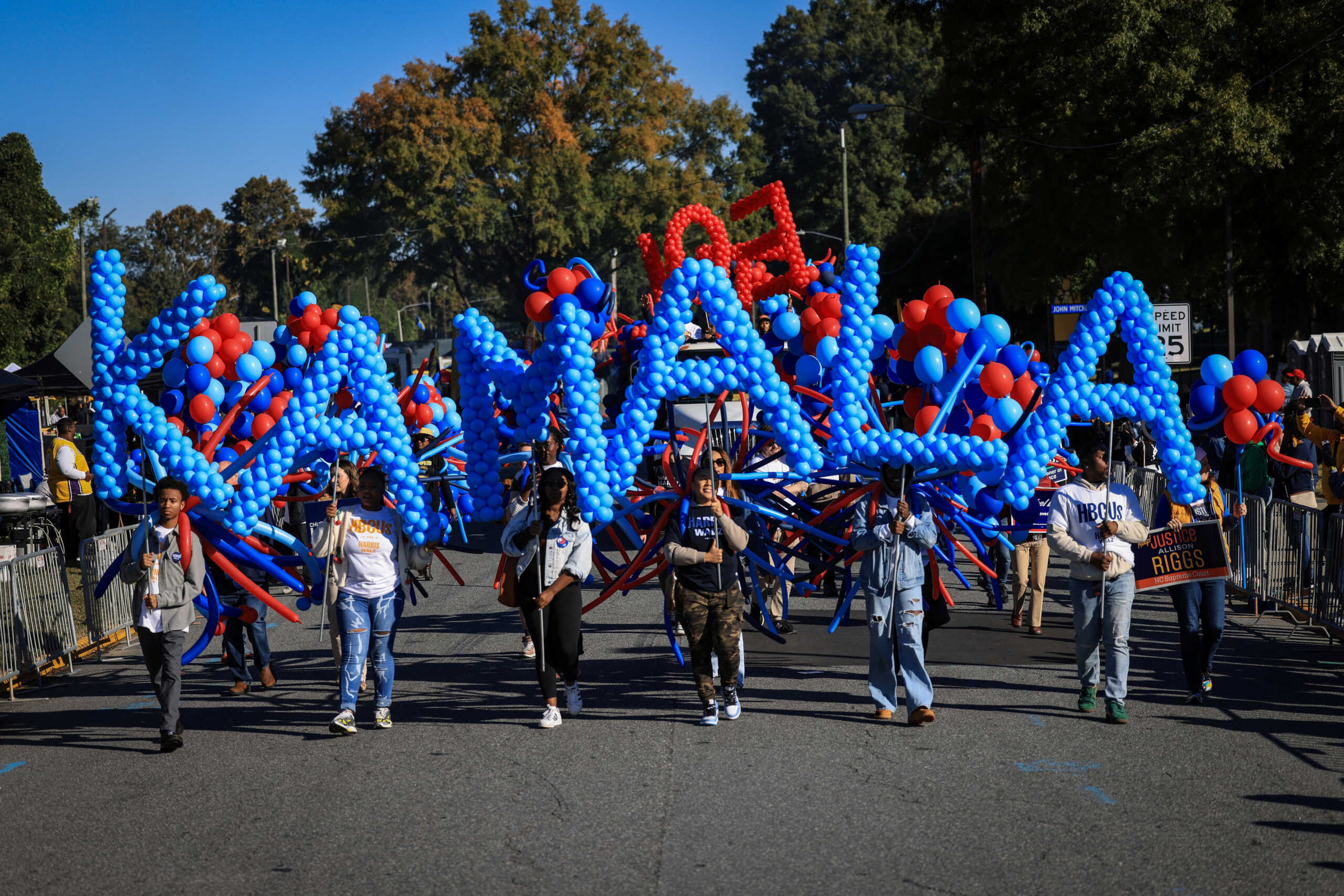 Marchers carry balloons spelling "Kamala" ahead of the 2024 presidential elections, during homecoming at North Carolina Agricultural and Technical State University in Greensboro, North Carolina, U.S., October 19, 2024. HBCU campuses were throbbing with excitement as generations gathered, knowing that Howard University graduate and Democrat presidential candidate Kamala Harris had a chance of becoming the first HBCU graduate in the Oval Office "What Kamala Harris means to Howard is a full realization that the possibilities are endless." said Howard alum Cameron Trimble, 42. "When people say, "You could do anything," and then you see the person who did, who walked the same halls as you, who slept in the same dorm as you, took classes, came of age in the same place as you did, and can go on to have the most powerful office in the land. It imbues so many different people with so much confidence and so much hope and so much possibility." REUTERS