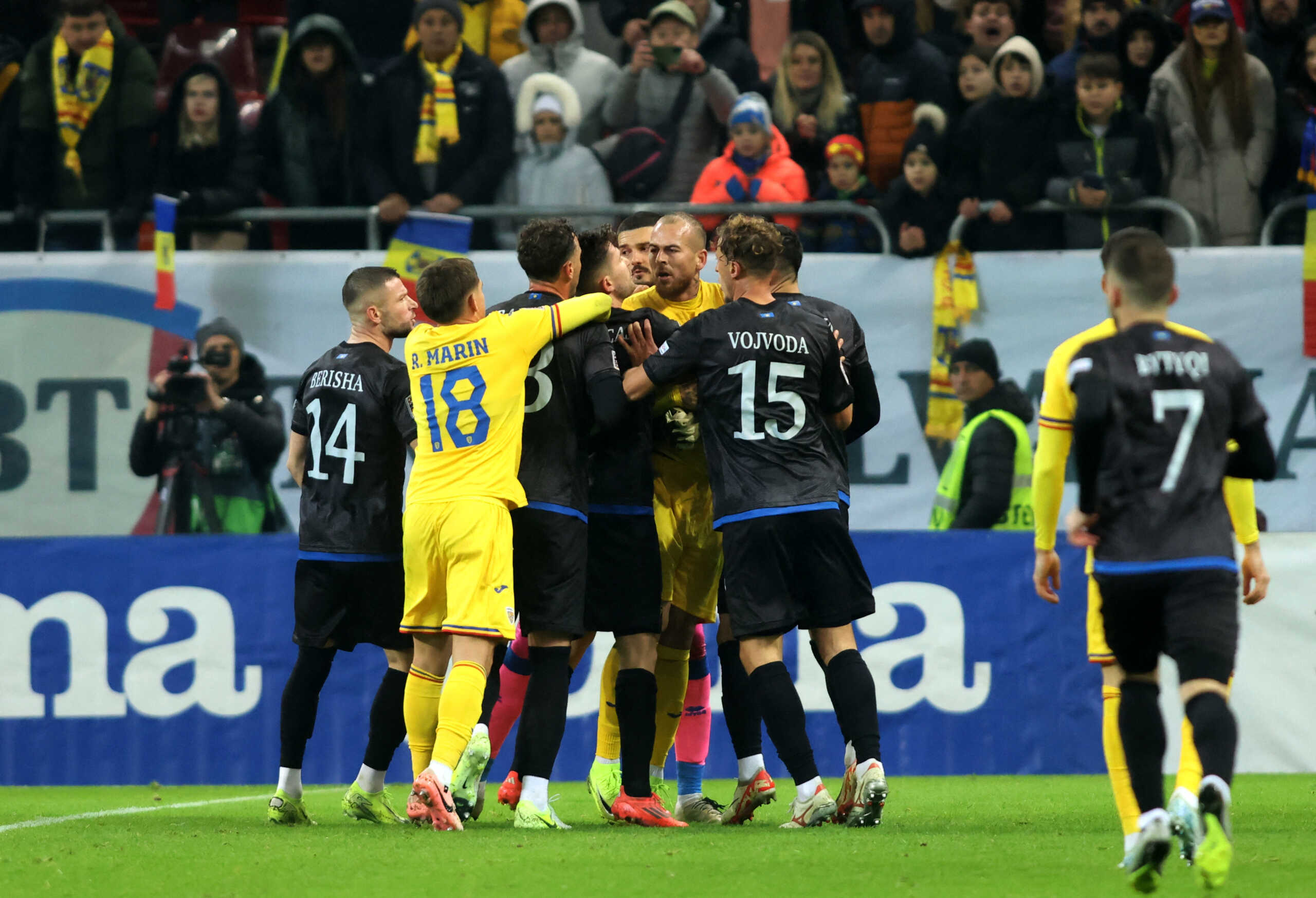 Soccer Football - Nations League - Group Stage - Romania v Kosovo - The National Arena, Bucharest, Romania - November 15, 2024 Kosovo's Amir Rrahmani clashes with Romania's Denis Alibec as players react Inquam Photos via REUTERS