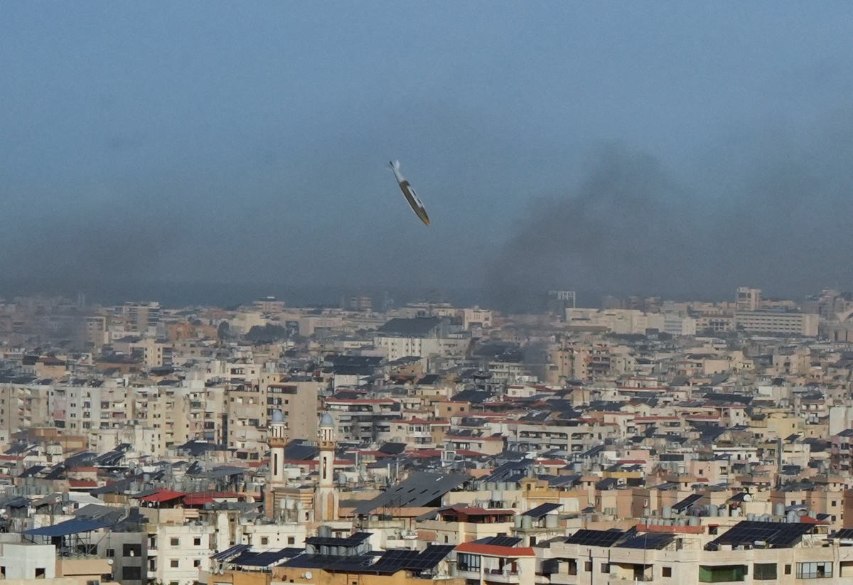 A view shows a munition over Beirut's southern suburbs, dropped from an Israeli fighter jet, amid the ongoing hostilities between Hezbollah and Israeli forces, as seen from Hadath, Lebanon, November 17, 2024. REUTERS