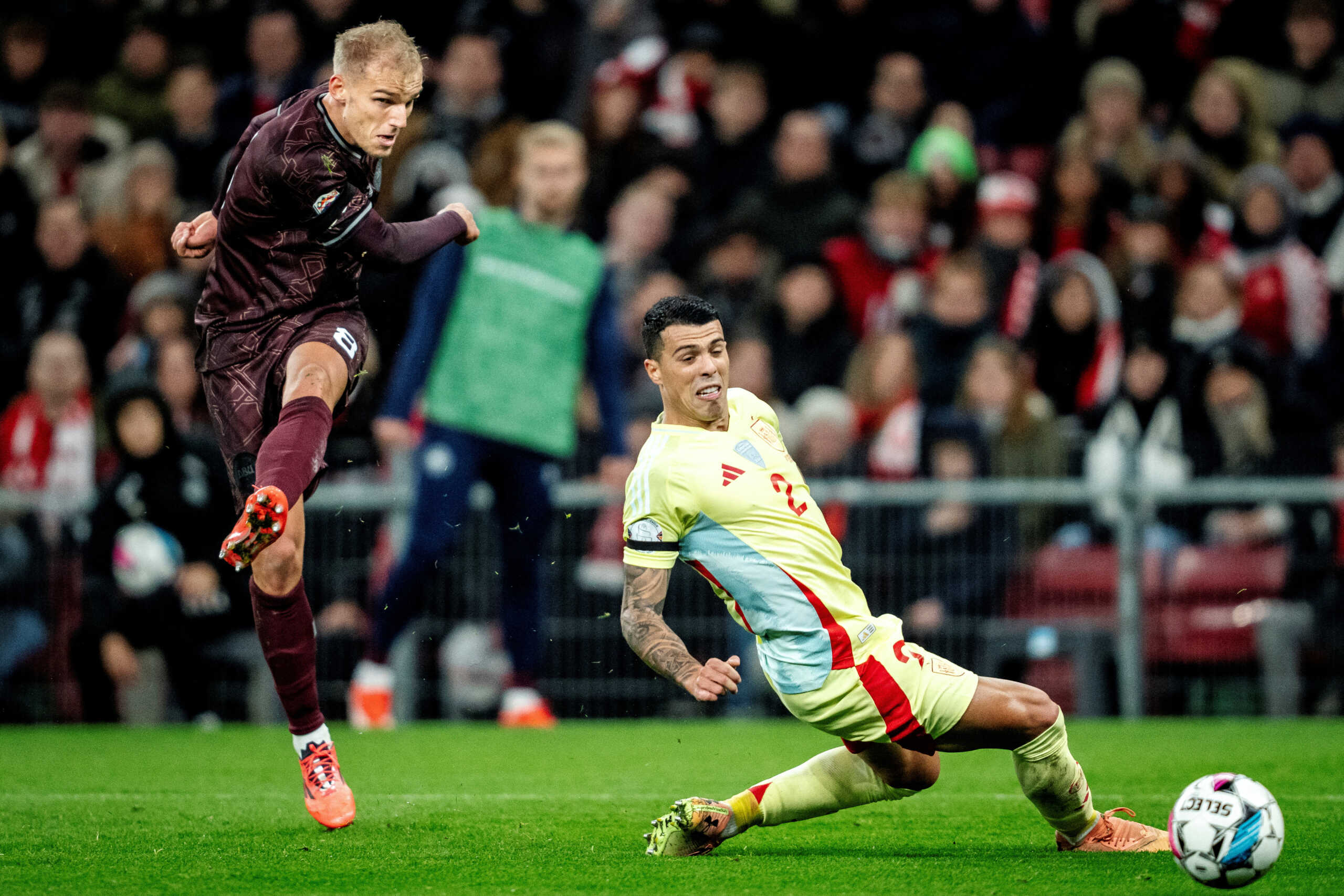 Soccer Football - Nations League - Denmark v Spain - Parken, Copenhagen, Denmark - November 15, 2024 Denmark's Gustav Isaksen in action with Spain's Pedro Porro Mads Claus Rasmussen