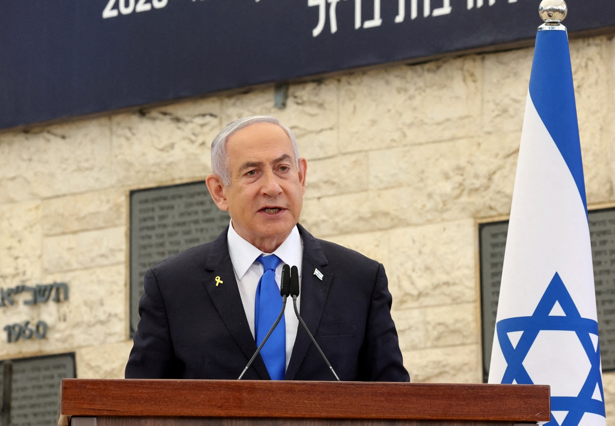 FILE PHOTO: Israeli Prime Minister Benjamin Netanyahu speaks during a memorial ceremony of the Hamas attack on October 7 last year that sparked the ongoing war in Gaza, at the Mount Herzl military cemetery in Jerusalem on October 27, 2024.