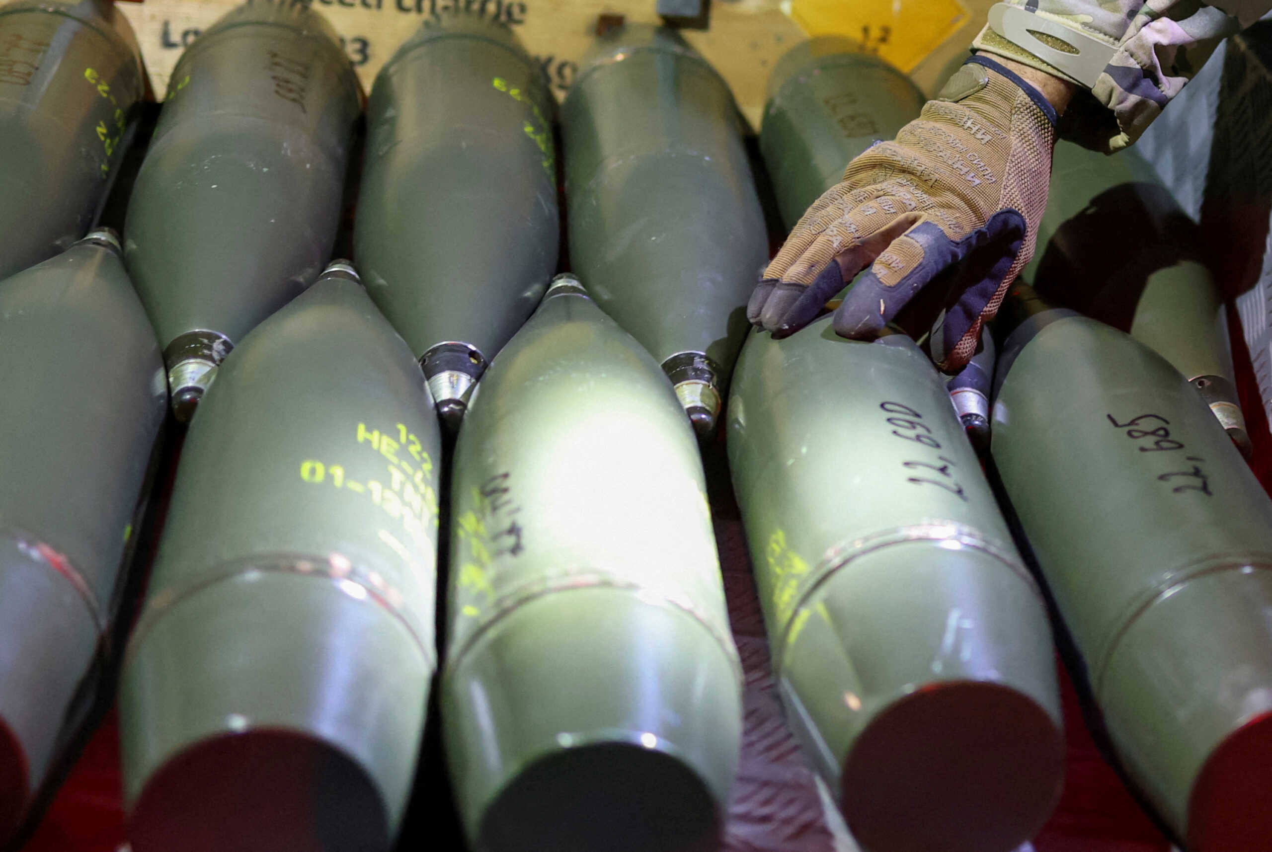 FILE PHOTO: A Ukrainian serviceman checks artillery shells at his frontline position, amid Russia's attack on Ukraine, in an undisclosed location in southern Ukraine October 25, 2024. REUTERS