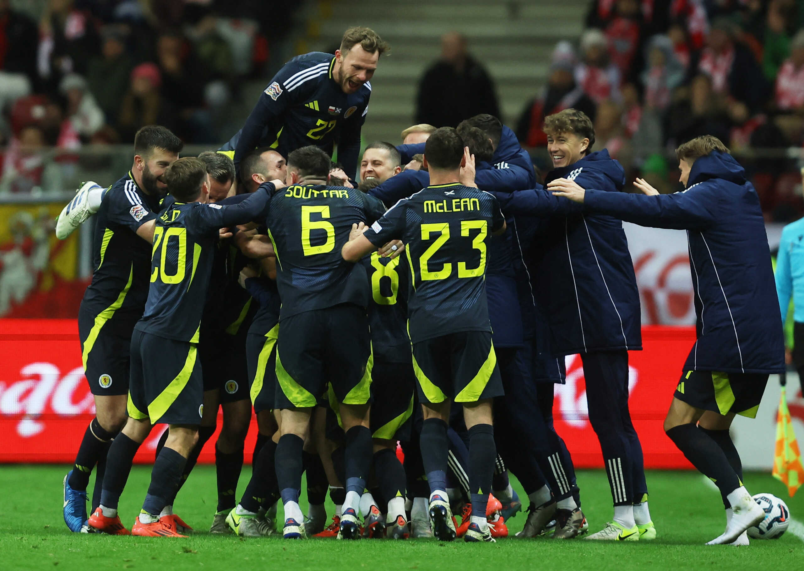 Soccer Football - Nations League - Group Stage - Poland v Scotland - Kazimierz Gorski National Stadium, Warsaw, Poland - November 18, 2024 Scotland's Andrew Robertson celebrates scoring their second goal with teammates REUTERS