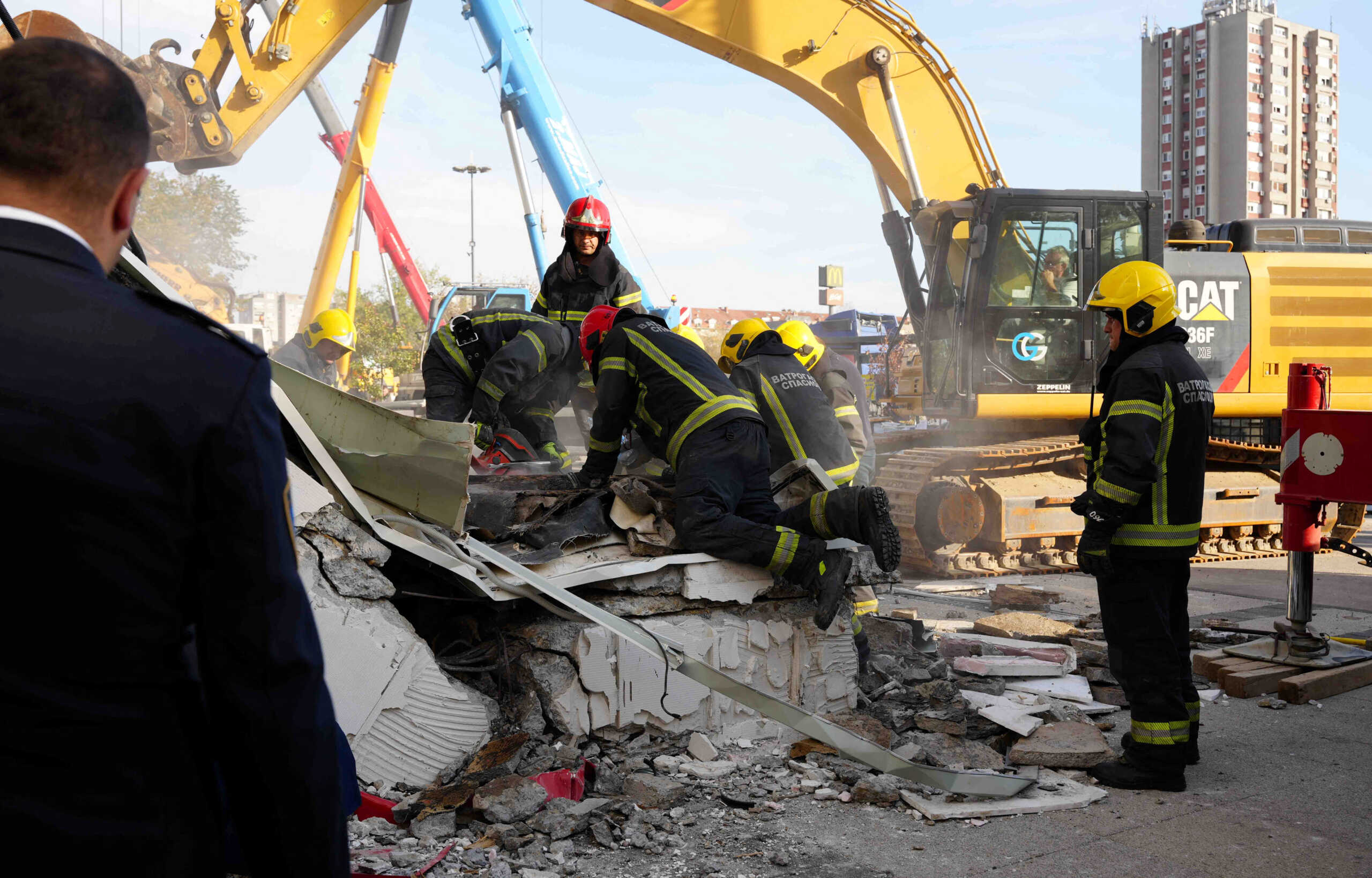 Rescue workers remove debris after a roof collapsed at the entrance to a railway station in Novi Sad, Serbia, November 1, 2024. Serbian Interior Ministry