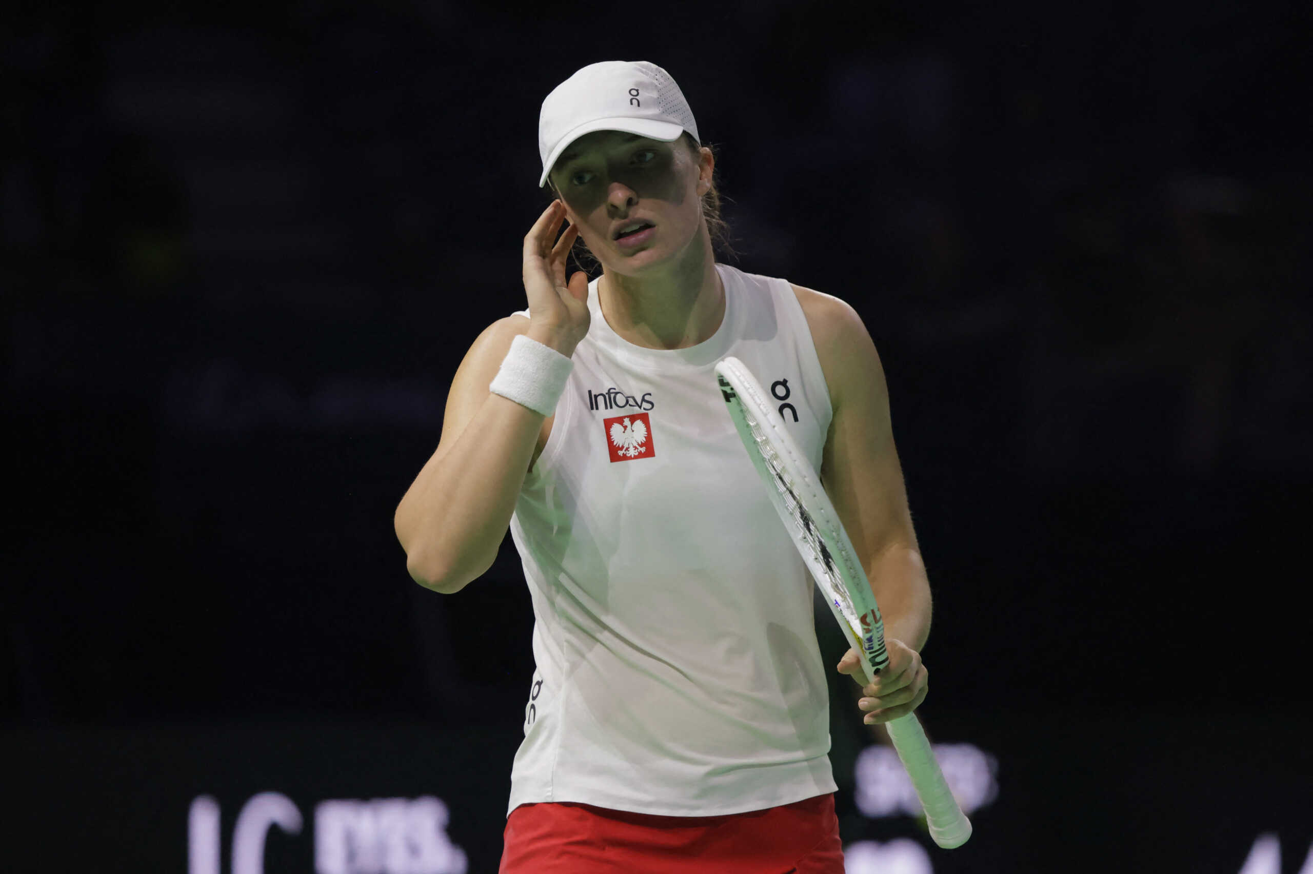 Tennis - Billie Jean King Cup Finals - Semi Final - Poland v Italy - Palacio de Deportes Jose Maria Martin Carpena Arena, Malaga, Spain - November 18, 2024 Poland's Iga Swiatek reacts during her match against Italy's Jasmine Paolini REUTERS