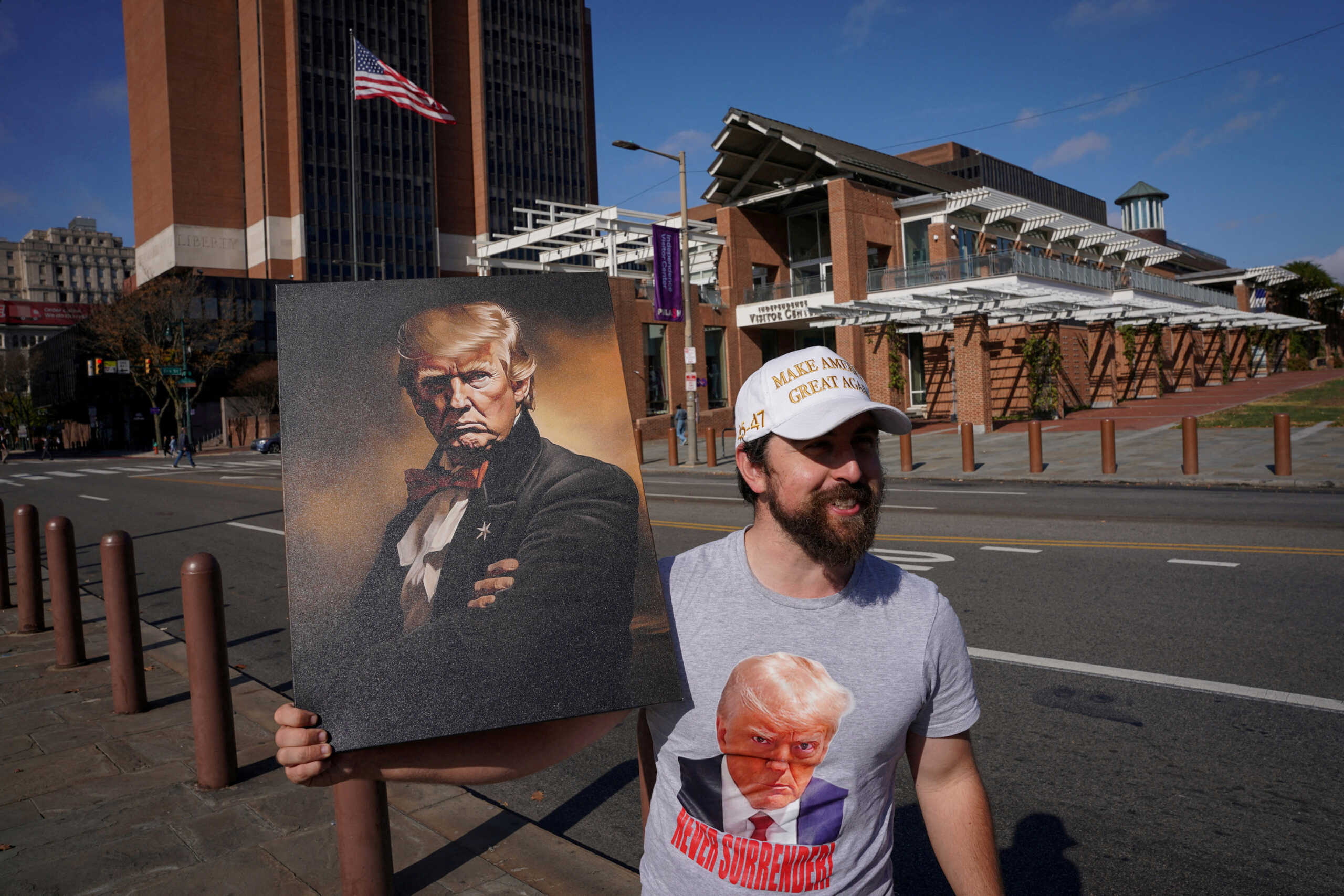 FILE PHOTO: Joe Livaudais, from Virginia, holds an image depicting Republican presidential nominee and former U.S. President Donald Trump during the 2024 U.S. presidential election on Election Day in Philadelphia, Pennsylvania, U.S., November 5, 2024. REUTERS