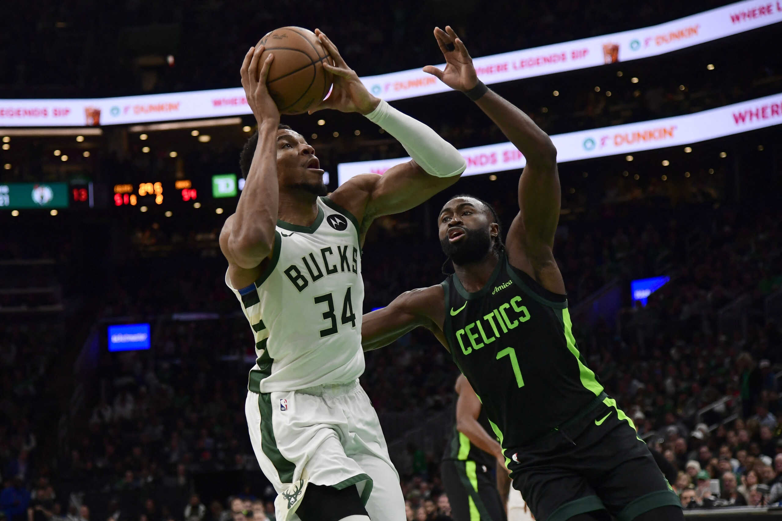 Dec 6, 2024; Boston, Massachusetts, USA;  Milwaukee Bucks forward Giannis Antetokounmpo (34) drive to the basket while Boston Celtics guard Jaylen Brown (7) defends during the first half at TD Garden. Mandatory Credit: Bob DeChiara-Imagn Images