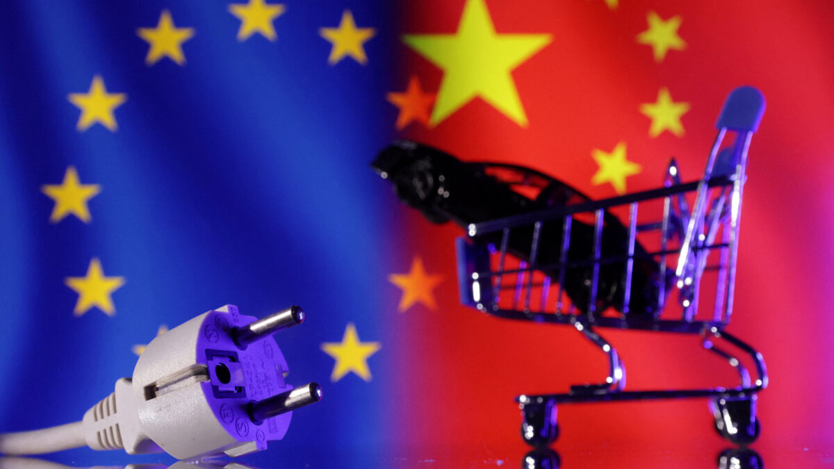 Power plug, shopping cart and miniature car are seen in front of EU and Chinese flags in this illustration taken December 17, 2024. REUTERS