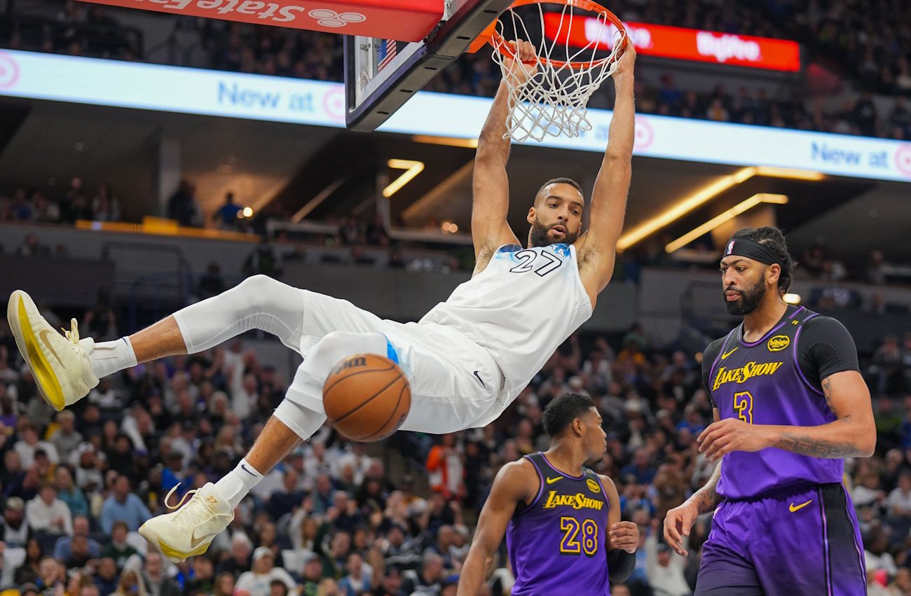 Dec 2, 2024; Minneapolis, Minnesota, USA; Minnesota Timberwolves center Rudy Gobert (27) dunks against the Los Angeles Lakers in the third quarter at Target Center. Mandatory Credit: Brad Rempel-Imagn Images