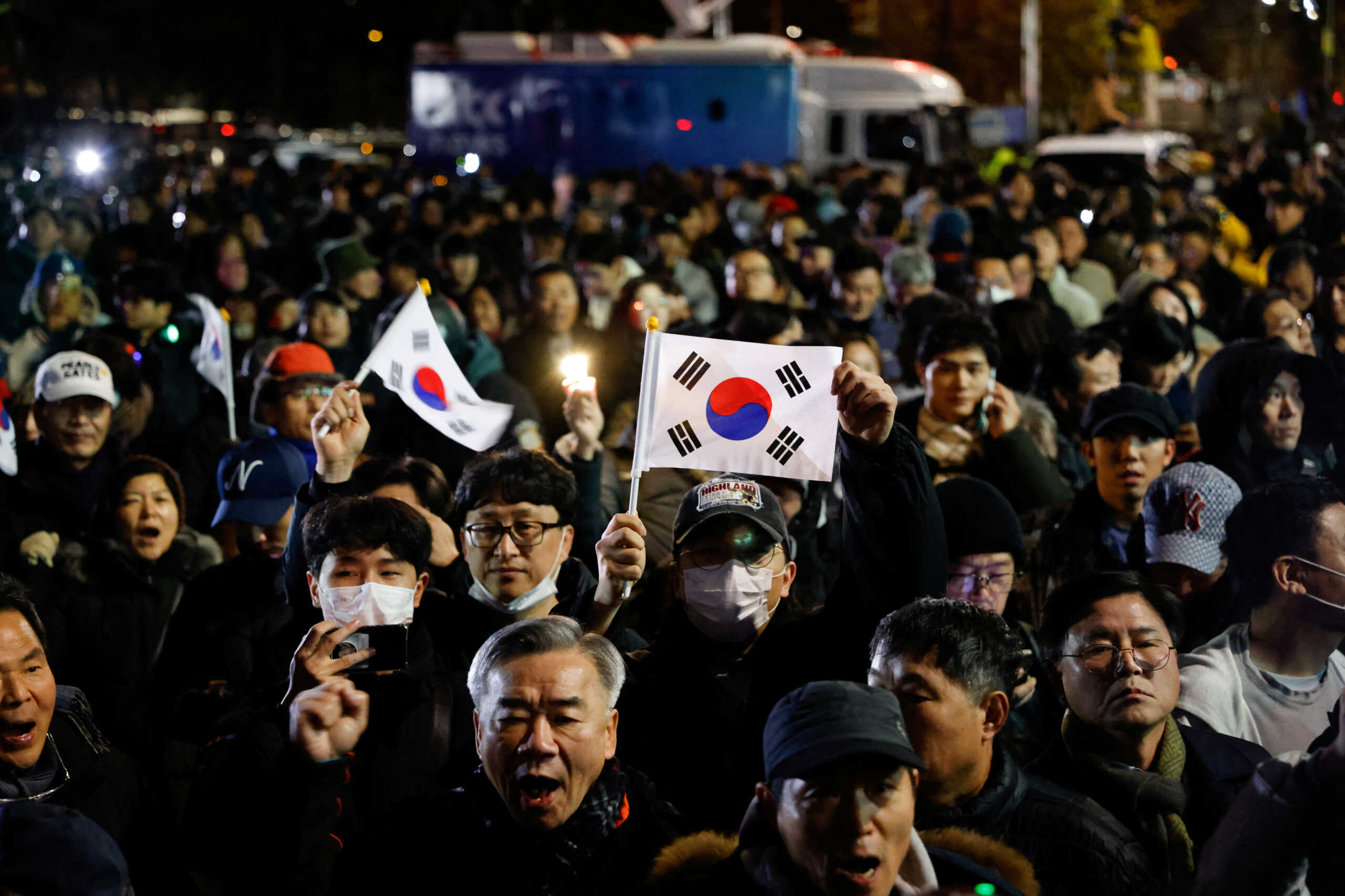 People gather outside the National Assembly, after South Korean President Yoon Suk Yeol declared martial law, in Seoul, South Korea, December 4, 2024. REUTERS