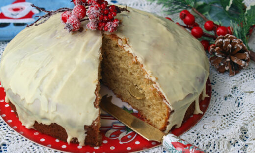 Homemade Greek Vasilopita covered in white chocolate icing