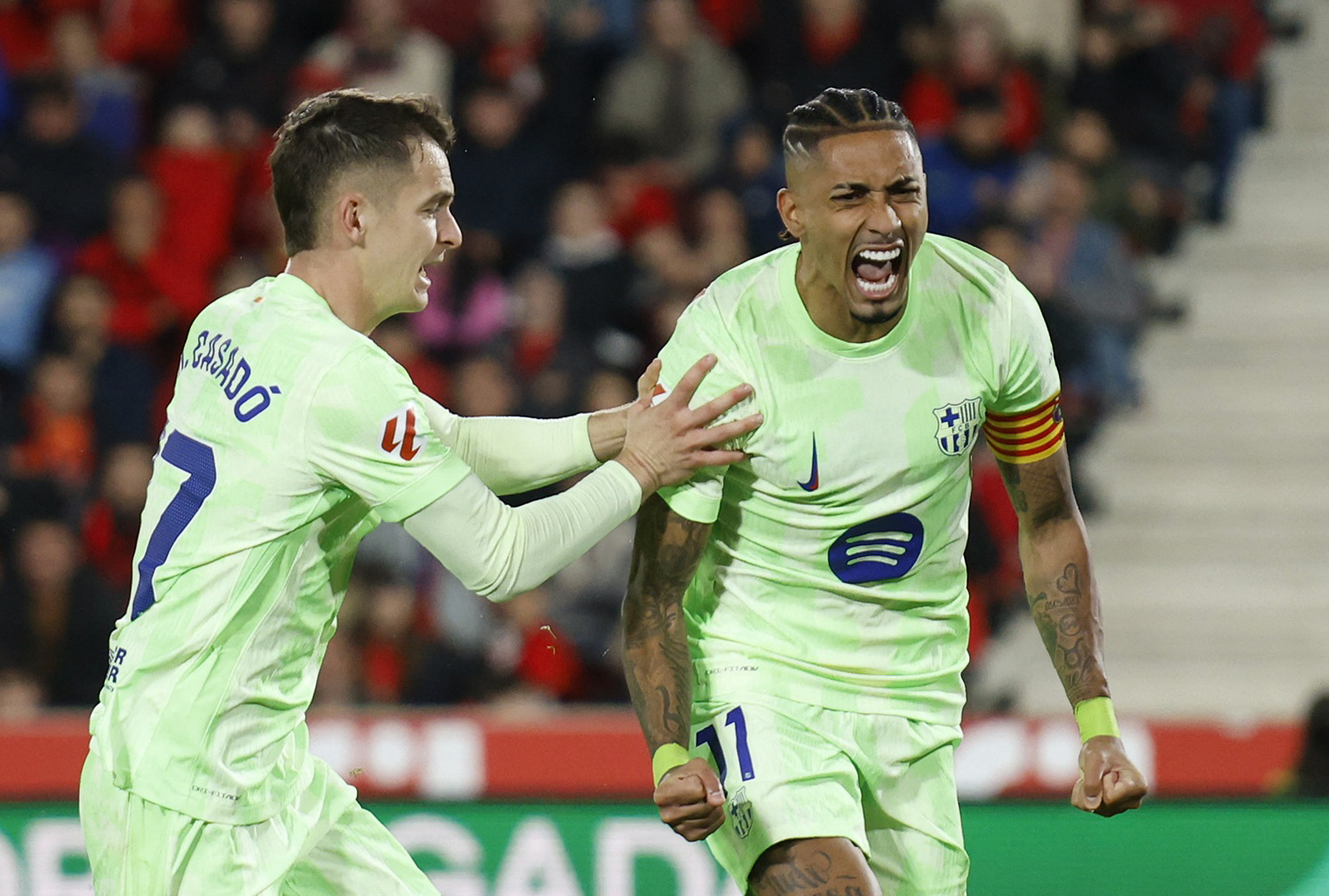 Soccer Football - LaLiga - RCD Mallorca v FC Barcelona - Estadi Mallorca Son Moix, Palma, Mallorca, Spain - December 3, 2024 FC Barcelona's Raphinha celebrates scoring their second goal with Marc Casado REUTERS