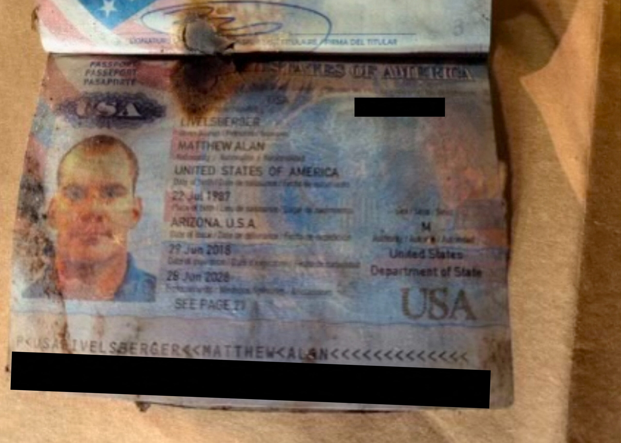 A damaged U.S. passport of Matthew Livelsberger, 37, an active-duty Army soldier from Colorado Springs and who the police identified as the driver of the Tesla Cybertruck that exploded outside the Trump International Hotel, is seen in Las Vegas, Nevada, U.S. January 2, 2025. Las Vegas Metropolitan Police Department