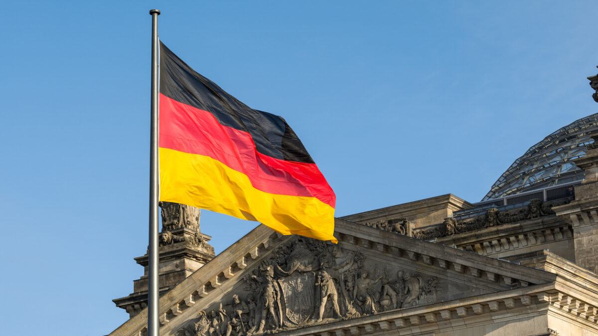 German flag fluttering front of Reichstag building