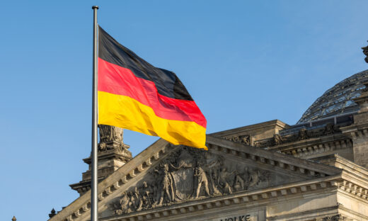 German flag fluttering front of Reichstag building