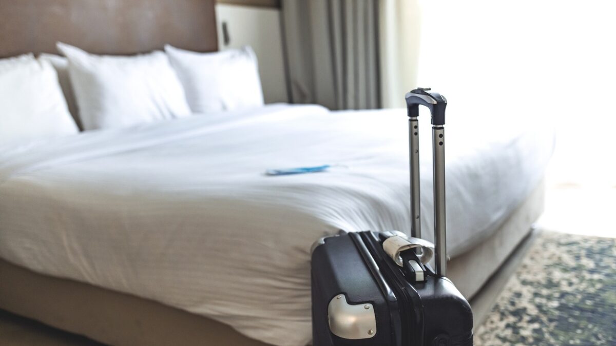 Black luggage in a hotel room