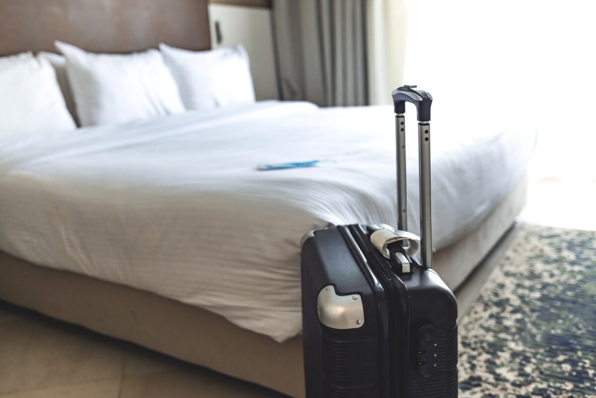 Black luggage in a hotel room