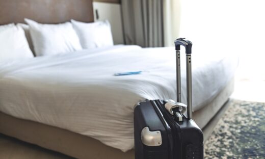 Black luggage in a hotel room