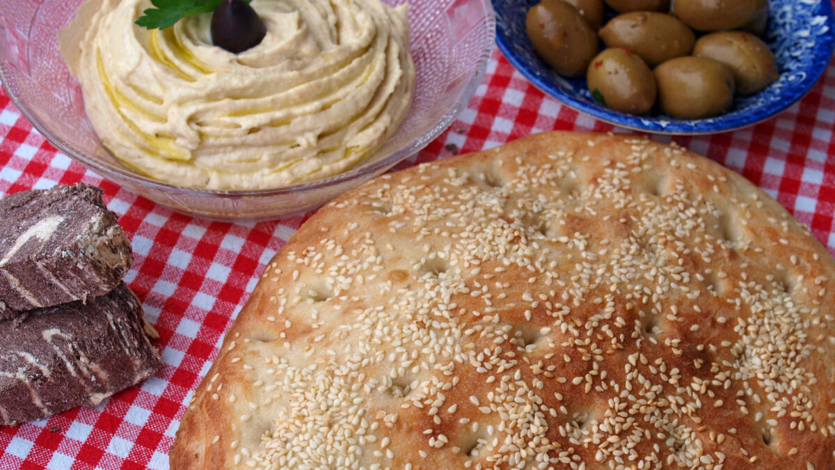 Lagana bread, taramosalata, olives and tahini halva