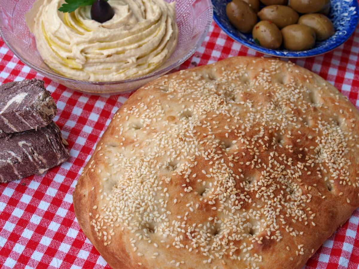 Lagana bread, taramosalata, olives and tahini halva