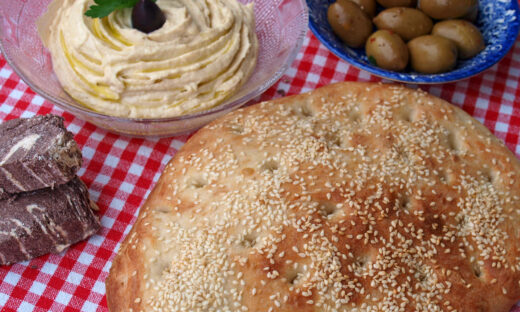 Lagana bread, taramosalata, olives and tahini halva