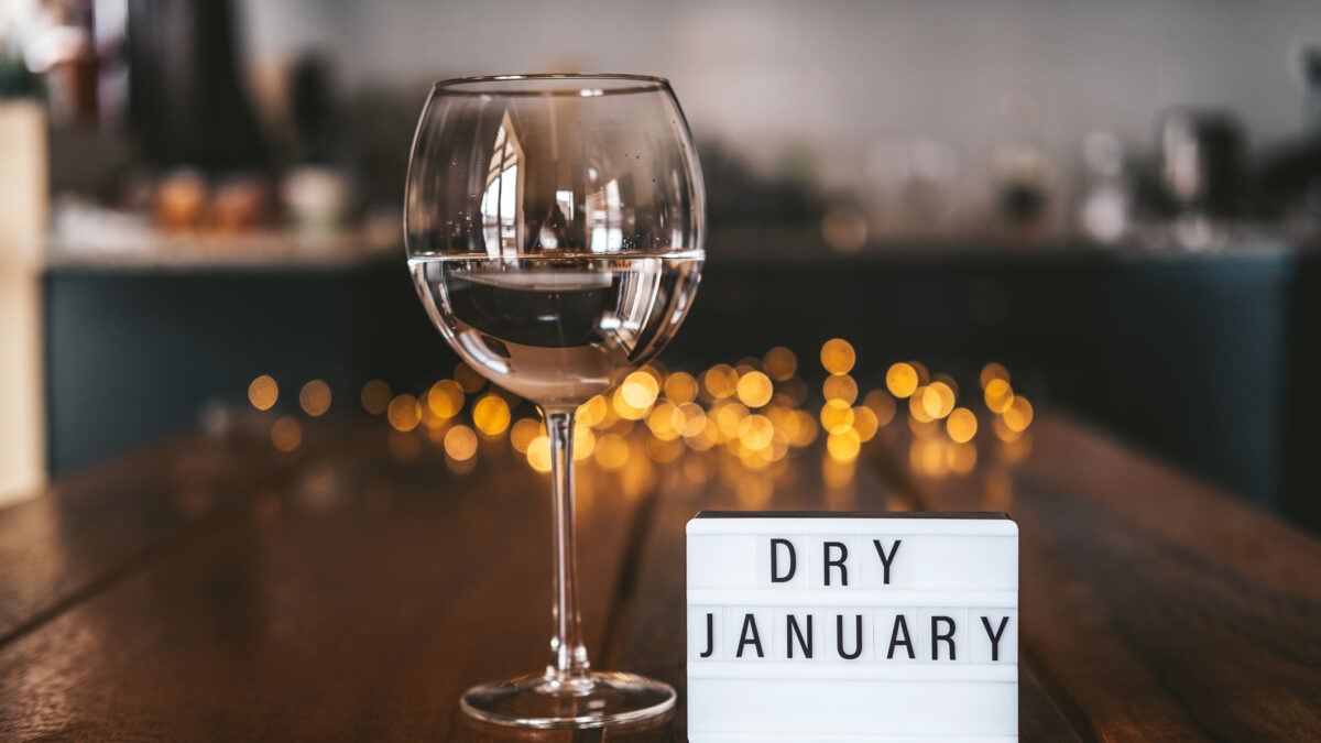 Challenge dry January. Wine glass with water. Non-alcoholic month. Concept of healthy lifestyle. In new year without alcohol. 31 days of abstinence from alcohol