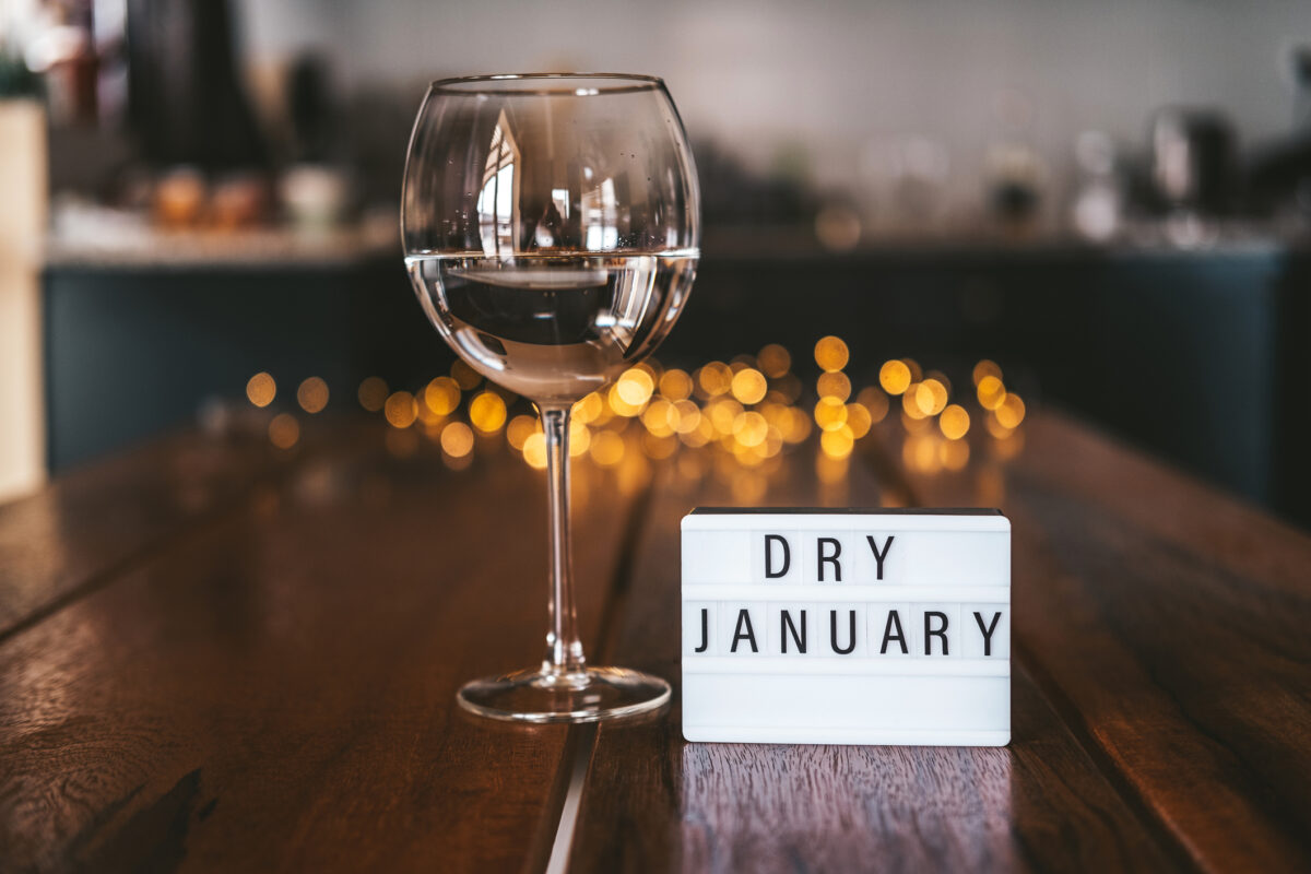 Challenge dry January. Wine glass with water. Non-alcoholic month. Concept of healthy lifestyle. In new year without alcohol. 31 days of abstinence from alcohol