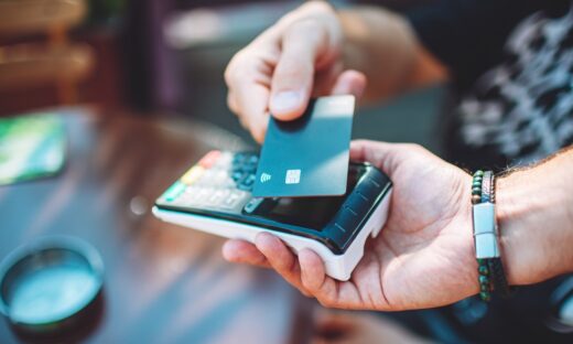 Adult man paying with credit card