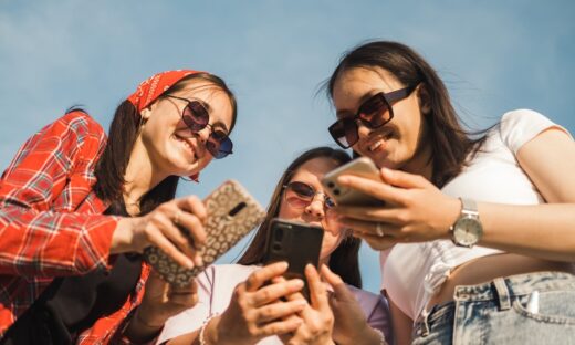 Group of young people using mobile phone