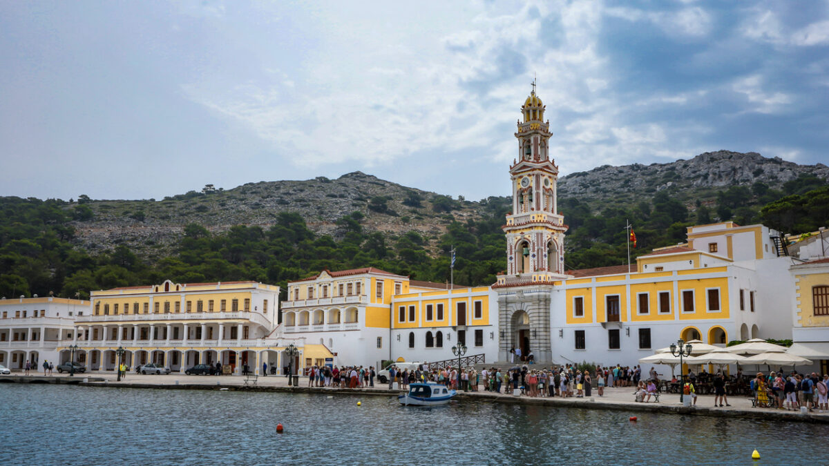 Symi, Greece - May 30, 2023:  Monastery of Archangel Michael on the sea front of Panormitis village.