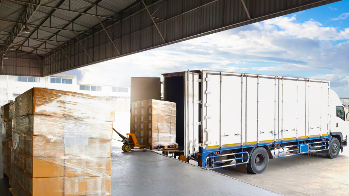 Container Trucks Parked Loading Package Boxes Pallets at Warehouse Dock