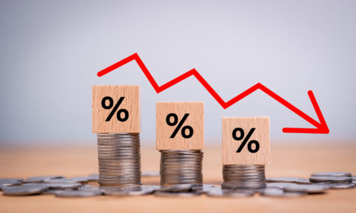 Percentage sign on wooden cubes with Stack of coin bar chart