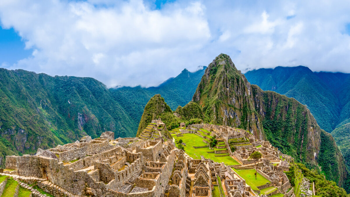 Machu Picchu, Aguas Calientes, Peru: Machu Picchu is a 15th-century Inca citadel located in the Eastern Cordillera of southern Peru on a 2,430-meter (7,970 ft) mountain ridge. It is located in the Machupicchu District within Urubamba Province above the Sacred Valley, which is 80 kilometers (50 mi) northwest of Cusco. The Urubamba River flows past it, cutting through the Cordillera and creating a canyon with a tropical mountain climate. Most recent archaeologists believe that Machu Picchu was constructed as an estate for the Inca emperor Pachacuti (1438–1472). Often referred to as the "Lost City of the Incas", it is the most familiar icon of Inca civilization. The Incas built the estate around 1450 but abandoned it a century later, at the time of the Spanish conquest.