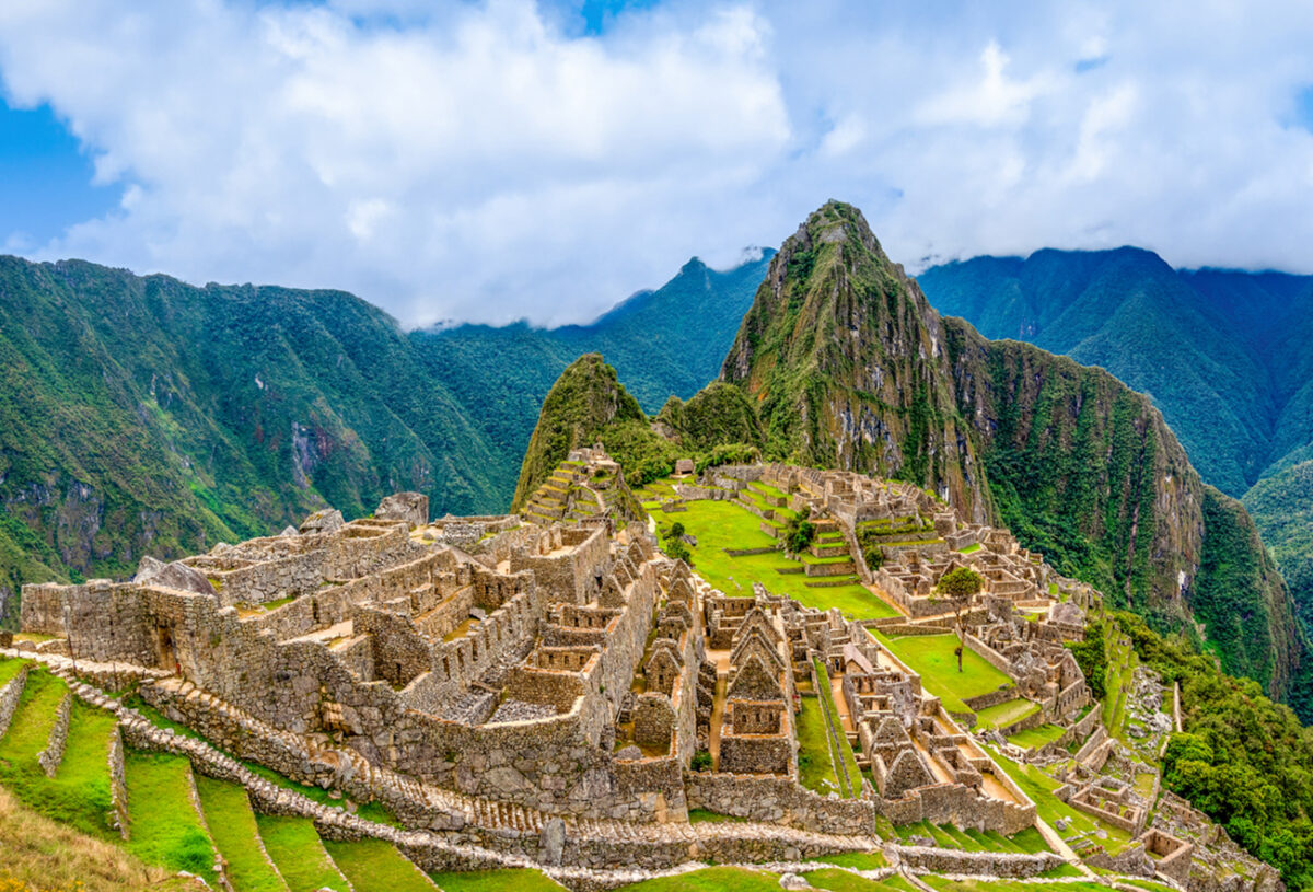 Machu Picchu, Aguas Calientes, Peru: Machu Picchu is a 15th-century Inca citadel located in the Eastern Cordillera of southern Peru on a 2,430-meter (7,970 ft) mountain ridge. It is located in the Machupicchu District within Urubamba Province above the Sacred Valley, which is 80 kilometers (50 mi) northwest of Cusco. The Urubamba River flows past it, cutting through the Cordillera and creating a canyon with a tropical mountain climate. Most recent archaeologists believe that Machu Picchu was constructed as an estate for the Inca emperor Pachacuti (1438–1472). Often referred to as the "Lost City of the Incas", it is the most familiar icon of Inca civilization. The Incas built the estate around 1450 but abandoned it a century later, at the time of the Spanish conquest.