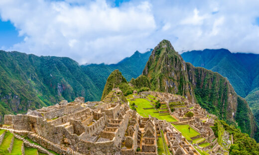 Machu Picchu, Aguas Calientes, Peru: Machu Picchu is a 15th-century Inca citadel located in the Eastern Cordillera of southern Peru on a 2,430-meter (7,970 ft) mountain ridge. It is located in the Machupicchu District within Urubamba Province above the Sacred Valley, which is 80 kilometers (50 mi) northwest of Cusco. The Urubamba River flows past it, cutting through the Cordillera and creating a canyon with a tropical mountain climate. Most recent archaeologists believe that Machu Picchu was constructed as an estate for the Inca emperor Pachacuti (1438–1472). Often referred to as the "Lost City of the Incas", it is the most familiar icon of Inca civilization. The Incas built the estate around 1450 but abandoned it a century later, at the time of the Spanish conquest.