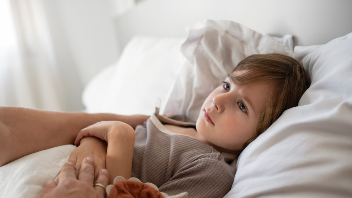 Little boy ill at home with a virus or infectious disease