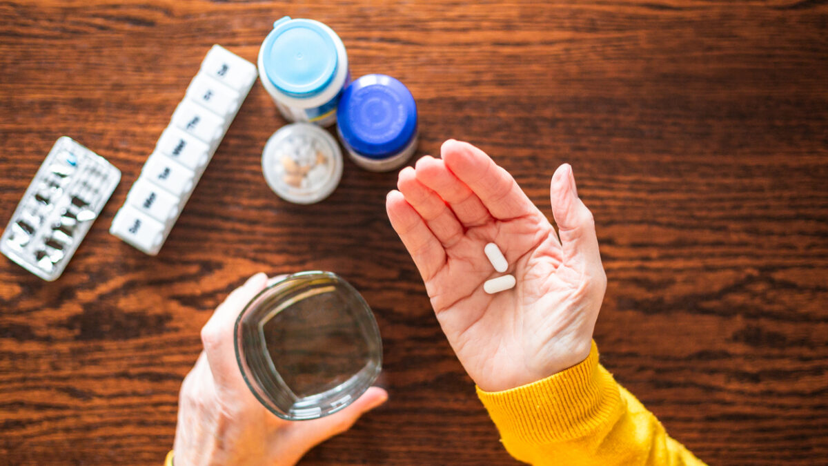 Senior woman taking a medical pill