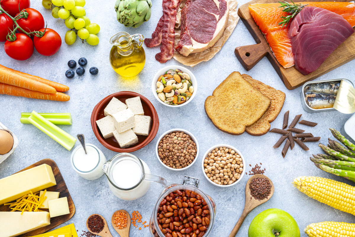 Overhead view of fresh and raw group of food including carbohydrates, proteins and dietary fiber. Healthy eating and dieting concept