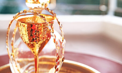 still life photography of traditional wedding crowns, decanter and chalice - greek wedding objects