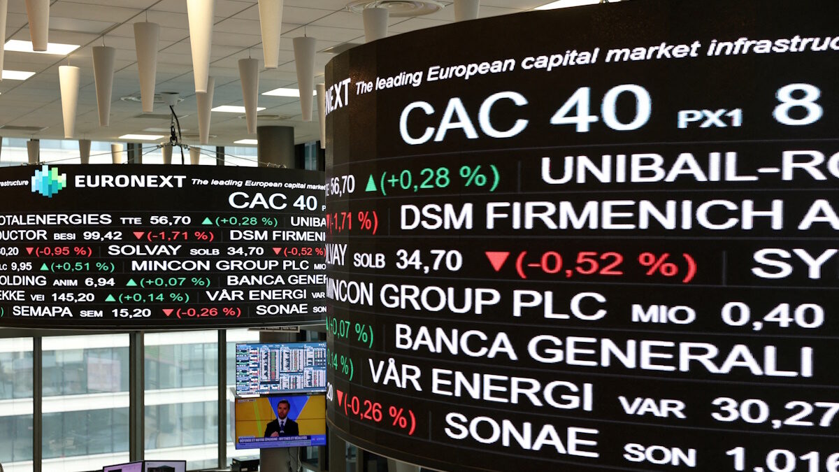 Trading data is displayed on digital boards at the Euronext stock exchange in the La Defense business district in Paris