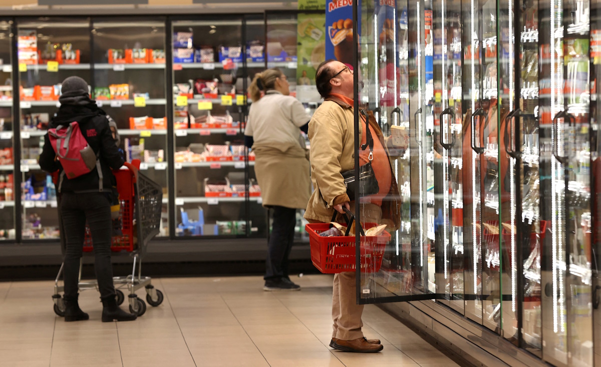 Customers shop at a supermarket in Budapest