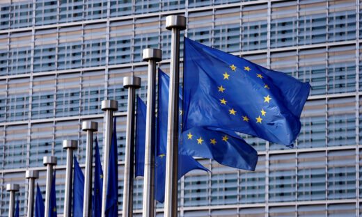 EU flags flutter outside the EU Commission headquarters