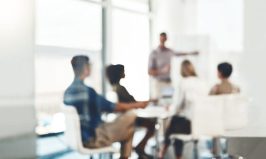 Defocused shot of a group of businesspeople having a meeting in an office