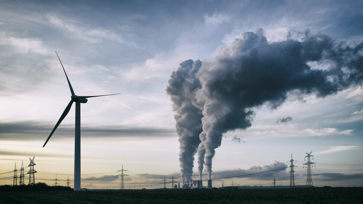 a coal burning power plant with pollution and electricity pylons