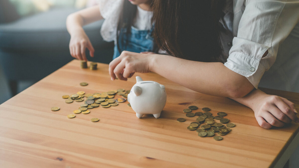 Mother and her daughter count coins